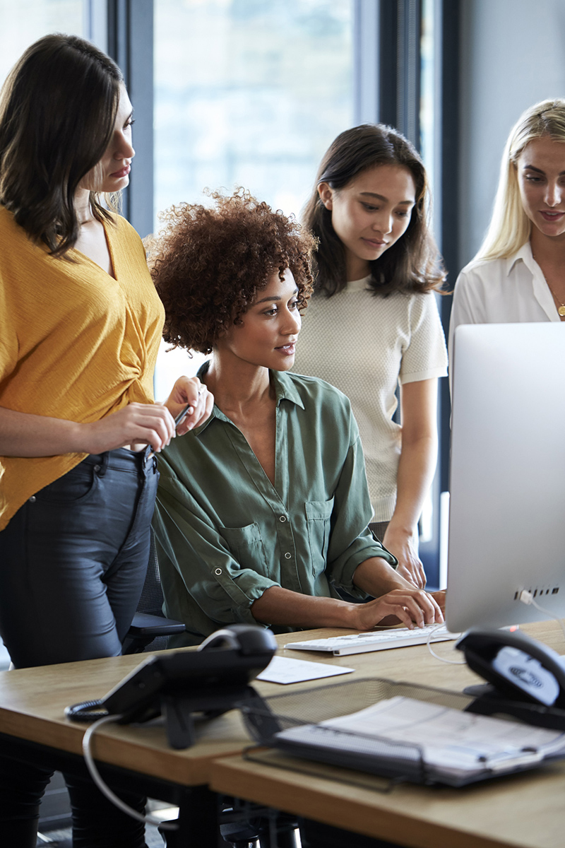 four-female-creatives-working-around-a-computer-mo-2026-01-05-06-28-12-utc1.jpg